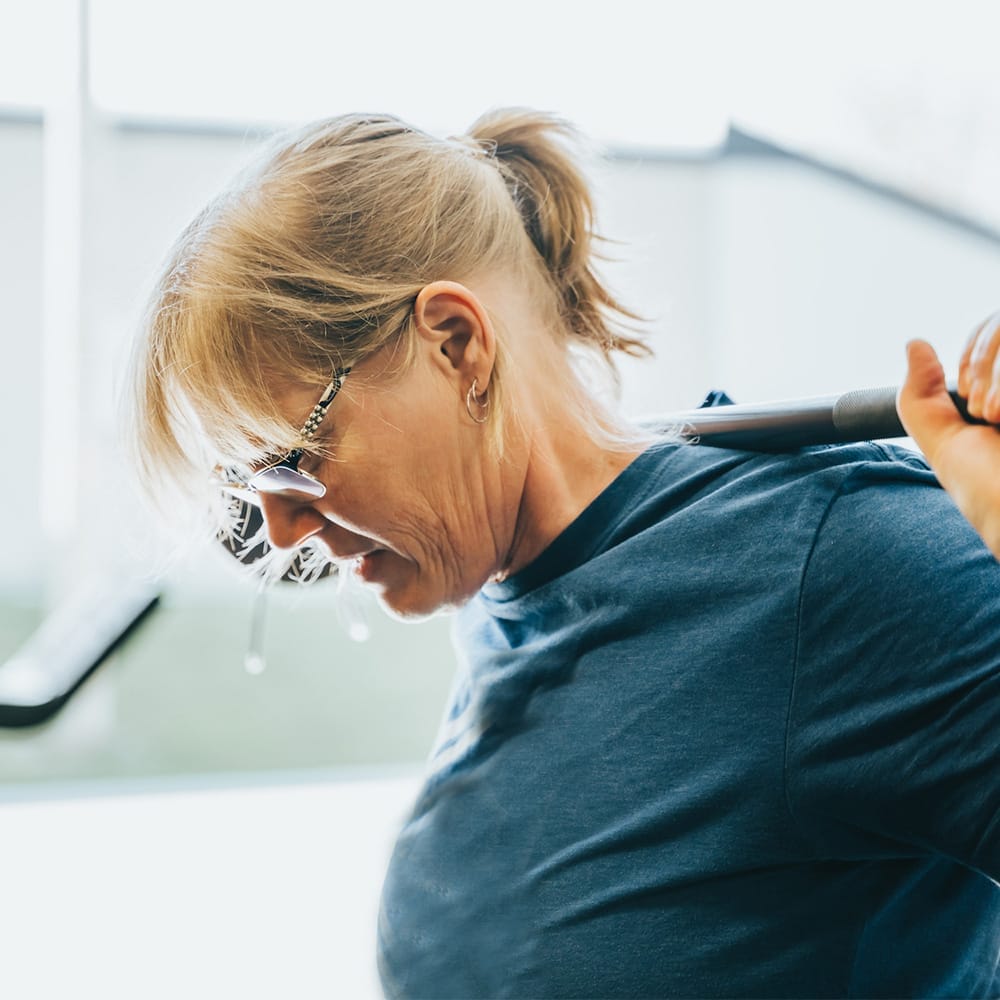 Home 4 woman lifting weights at the gym